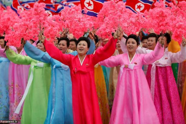 People react as they see North Korean leader Kim Jong Un during a mass rally and parade in Pyongyang